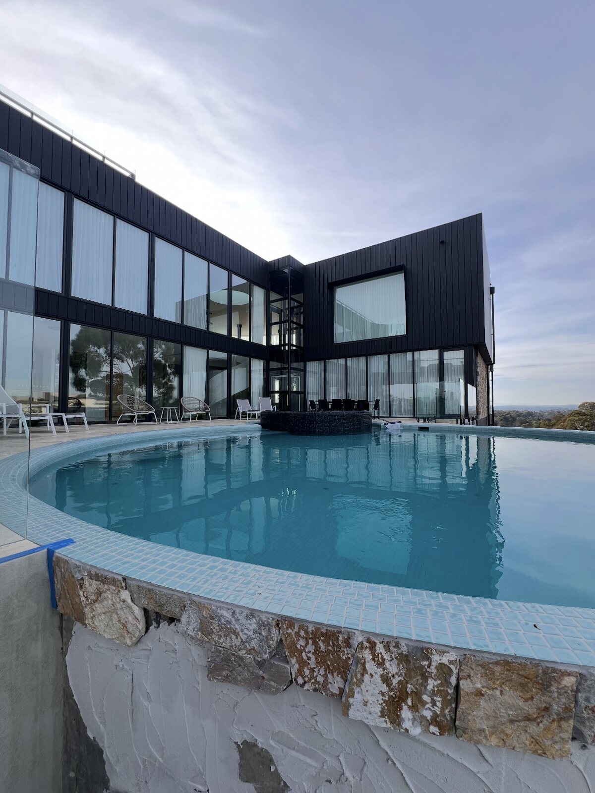 Pool surround and facade, architect-designed home