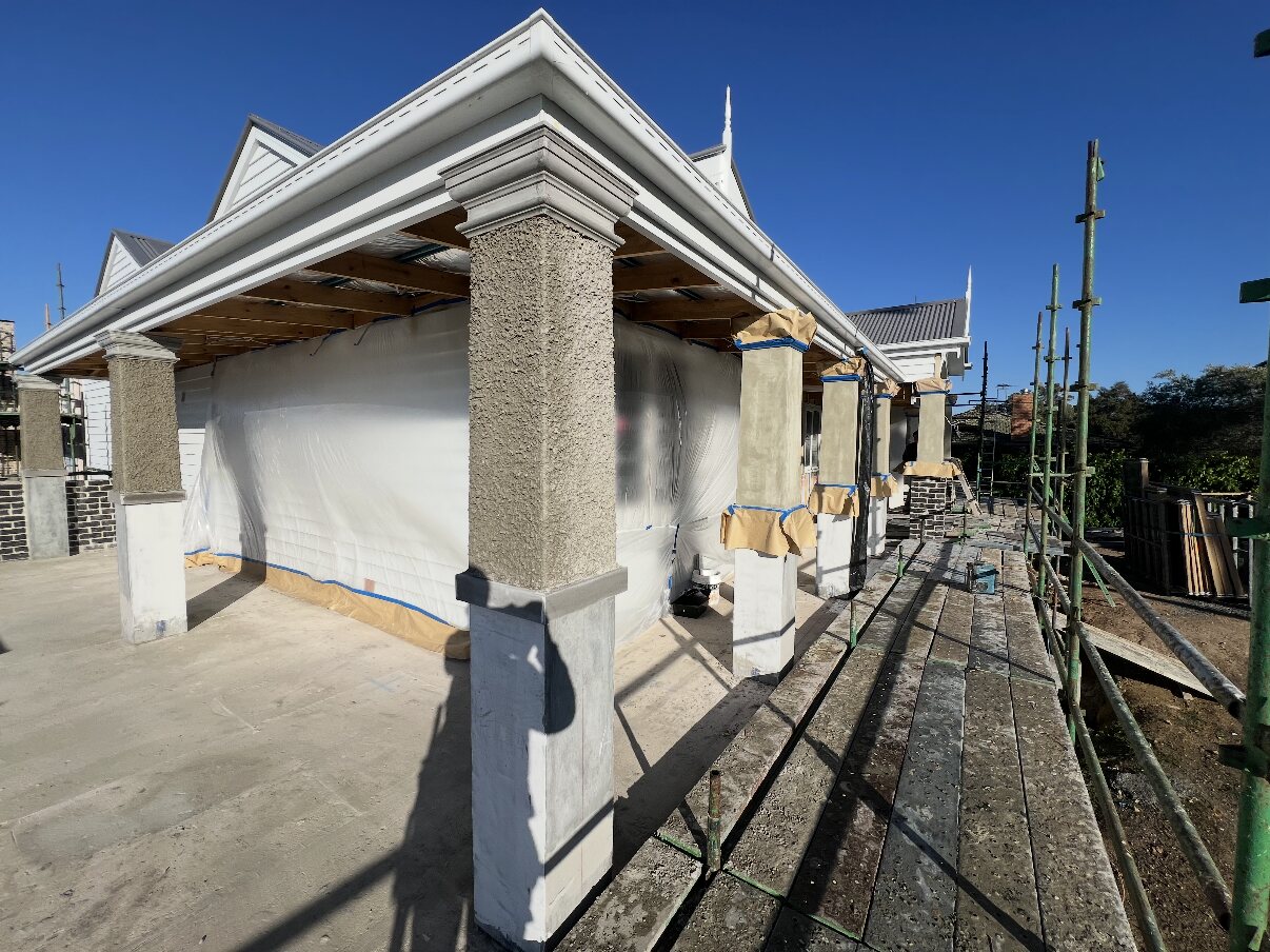 Rendered columns and portico