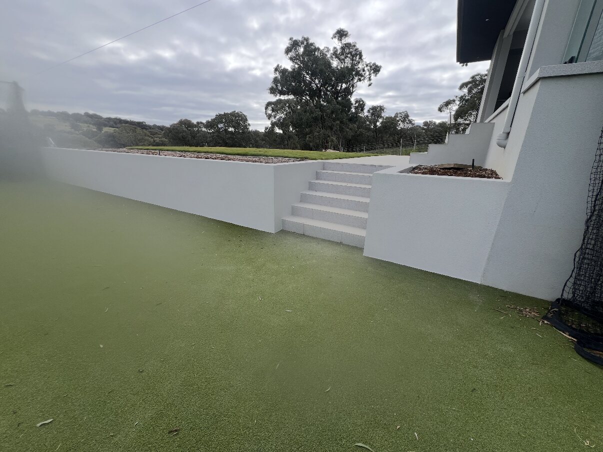 Rendered boundary wall and steps